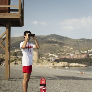 full-shot-lifeguard-with-binoculars full-shot-lifeguard-with-binoculars